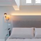 Fermaluce Wood, wooden wall lamp with curved extension