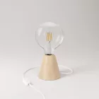 Table lamp with alder wood base and transparent bulb