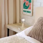 Table lamp with alder wood base and transparent bulb