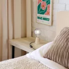 Table lamp with alder wood base and transparent bulb