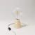 Table lamp with alder wood base and transparent bulb