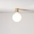 Metal wall lamp with porcelain-effect spherical bulb