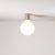 Metal wall lamp with porcelain-effect spherical bulb