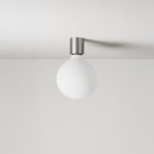 Metal wall lamp with porcelain-effect spherical bulb